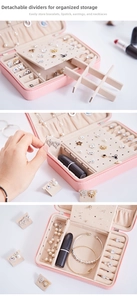 Pink leather jewelry organizer showing adjustable dividers and multi-layered storage detail