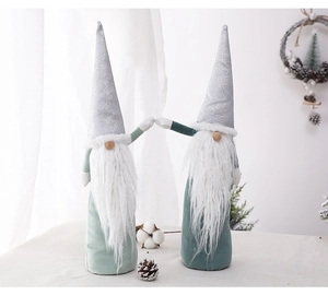 Detail of green sequin Christmas gnomes with white faux fur beards for holiday decor