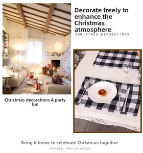 Classic black and white buffalo check place mat shown in a Christmas dining room setting