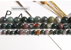 Detailed view of faceted natural Indian agate beads in assorted earthy tones and textures