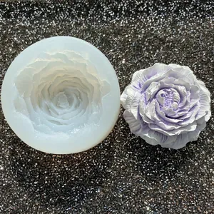Detailed view of 3D peony silicone mold with a finished purple plaster flower decoration