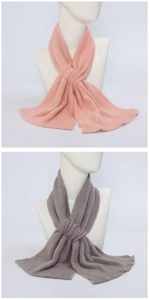 Detail of pink and grey plush scarves in a crossover style with soft thick texture
