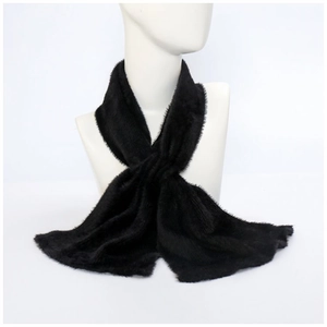 Detail of soft black faux fur scarf with a criss-cross design on a mannequin