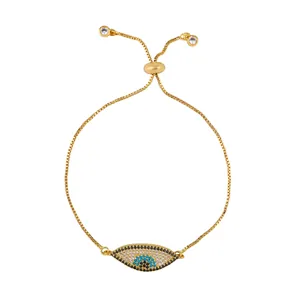 Detail of adjustable gold evil eye bracelet with blue zircon and sliding clasp closure