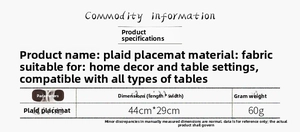 Close-up of a red and black plaid Christmas placemat featuring a festive reindeer motif