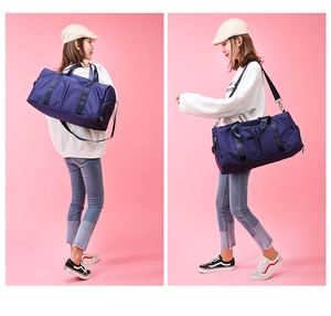 Deep blue sports duffel bag with a separate shoe compartment and adjustable shoulder strap