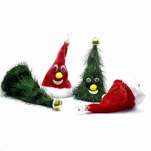 Detail of plush Christmas tree and hat decorations with bells and googly eyes