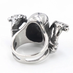 Close-up of vintage steel motorcycle ring featuring relief textures and rustic finish