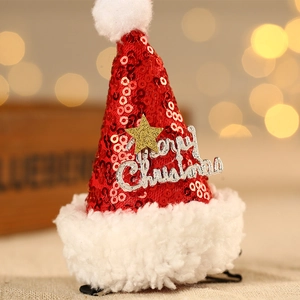 Détail de la pince à cheveux bonnet de Noël à paillettes avec étoile dorée et texte festif
