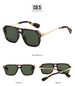 Detail view of tortoiseshell frames and gold metal temples on oversized sunglasses