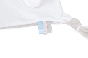 Close-up of soft plush baby security blanket with colorful ribbon tags and knotted edge