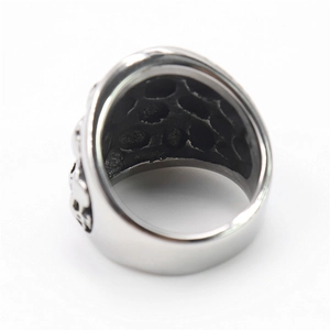 Punk style stainless steel skull ring with vintage silver finish and wide textured band