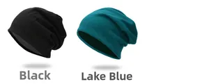 Detail of soft knitted slouchy beanies in black and lake blue for autumn and winter wear