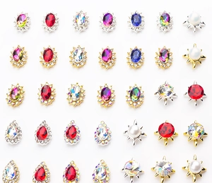 Macro shot of colorful K9 crystal rhinestones in gold and silver claw metal settings
