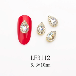 Close-up of K9 crystal drop nail charms with gold plating and LF3112 numbering