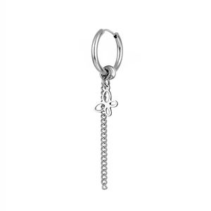 Macro shot of silver titanium steel hoop earring with hollow butterfly and long tassel chain
