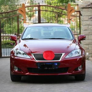 Brown reindeer antlers and red nose holiday decoration kit mounted on a car exterior