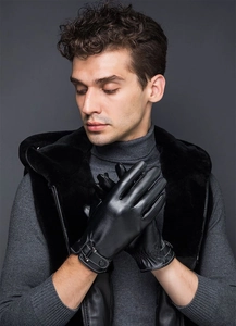 Detailed view of men's black PU leather gloves featuring wrist buckle and elastic texture