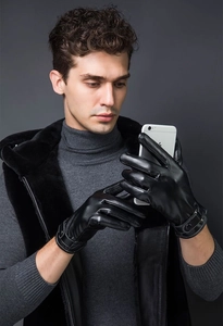 Touchscreen compatible black PU leather gloves showing smartphone use in autumn and winter