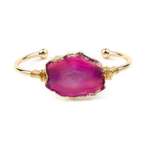 Handmade copper wire wrapped gold open bangle with raw pink druzy agate stone