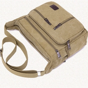 Durable khaki canvas crossbody bag for men with multiple zipper pockets and adjustable strap