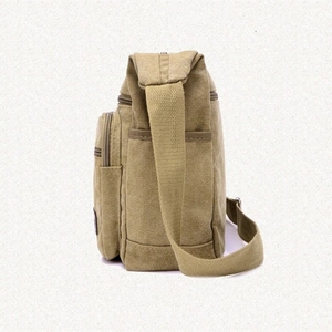 Large khaki canvas messenger bag side view with durable multi-zipper pockets