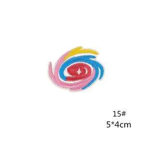 Detail of 5x4cm planet embroidery patch with colorful spiral stitching and adhesive back
