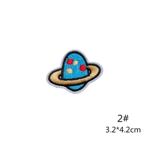 Detailed blue planet embroidery patch with gold rings and red spots, size 3.2x4.2cm