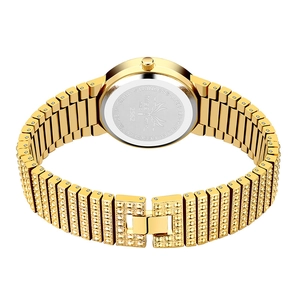 Detail of gold watch stainless steel back with MISS FOX brand logo and folding clasp