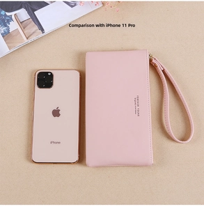 Size comparison of the soft pink long zipper wallet next to an iPhone 11 Pro