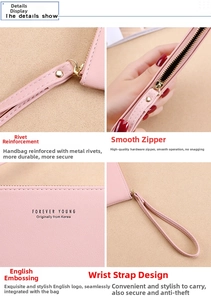 Detail of pink pebbled leather wristlet showing golden zipper, rivets and logo engraving