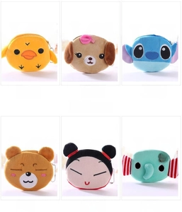 Close-up of cute plush coin purses featuring cartoon duck puppy and bear designs