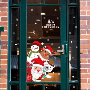 Christmas window stickers with Santa and reindeer on a festive glass door display