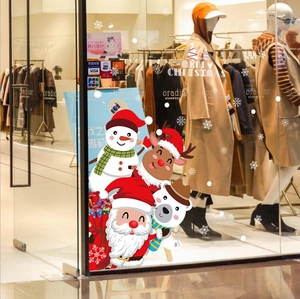 Christmas window decals with Santa Claus, snowmen, and reindeer for festive shop decoration