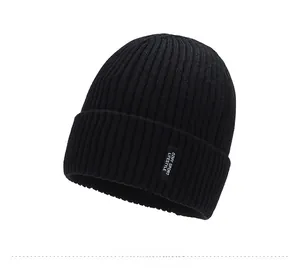 Close-up of black ribbed knit beanie with sport lifestyle woven label detail