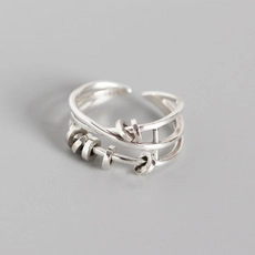 Detailed close-up of double-layer geometric S925 silver chain ring with moving beads