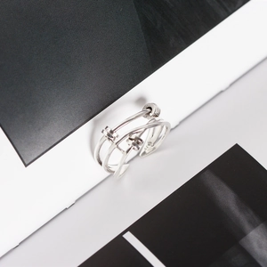 Macro shot of S925 hallmark on polished multilayer cross adjustable silver ring