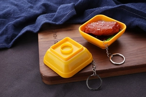 Realistic braised chicken wings food bowl keychain with sesame seeds on wood tray