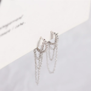 Detail view of S925 sterling silver geometric bead ring with triple fringe tassel chains