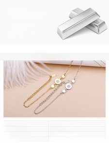 Detail of round sparkling zircon flower bracelet in gold and steel finish with extension chain