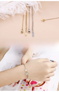 Close-up of sparkling round rhinestone bracelet with K14 gold plating and lobster clasp