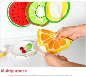Detail of soft absorbent microfiber hand towel wiping a ceramic plate in the kitchen