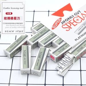 Flat lay of multiple 10-piece platinum eyebrow razor blade boxes on white grid