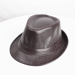 Detail of dark brown PU leather fedora featuring contrasting red stitching on the brim