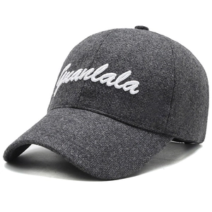 Deep grey wool blend baseball cap with white Juanlala embroidery in a 45-degree view