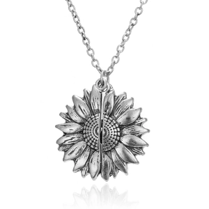 Polished silver sunflower locket necklace with an openable engraved pendant and silver chain