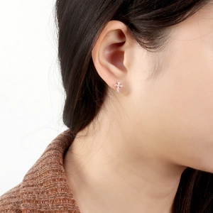S925 sterling silver cross stud earring with 4A zircon stones on female model ear