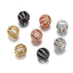Macro shot of hollow cubic zirconia beads for DIY jewelry in gold, silver and rose gold