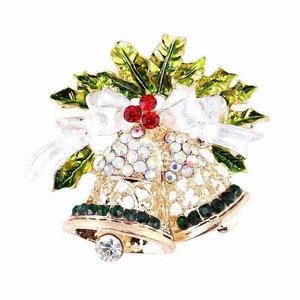 Close-up of Christmas twin bells brooch with green enamel leaves and red rhinestones