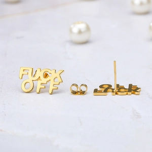 Polished rose gold stud earrings featuring a bold 'FUCK OFF' letter design on marble backdrop